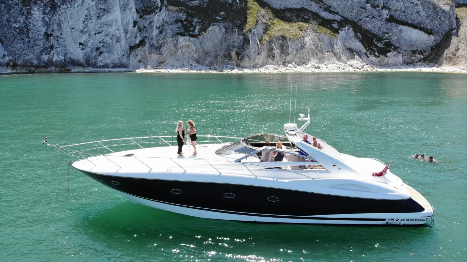 Shamu, Blue Water Charter's Sunseeker, at anchor in clear water off the south coast